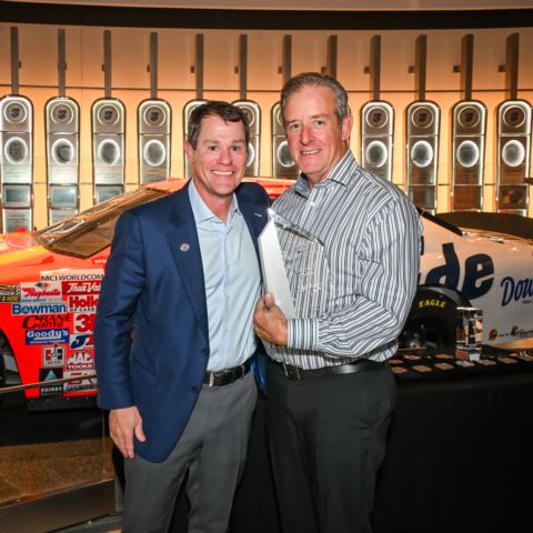 Kevin Camper (left) presents the Corporate Events Award to Randall Brown