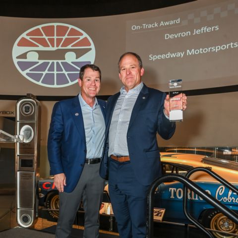 Kevin Camper (left) presents the On-Track Award to Devron Jeffers